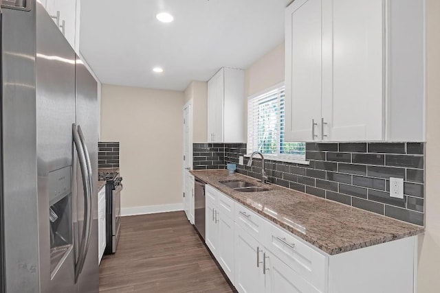 1808 Belford Dr, Austin, TX 78757 - kitchen featuring stainless steel appliances, dark wood-style floors, stone counters, white cabinetry, and tasteful backsplash