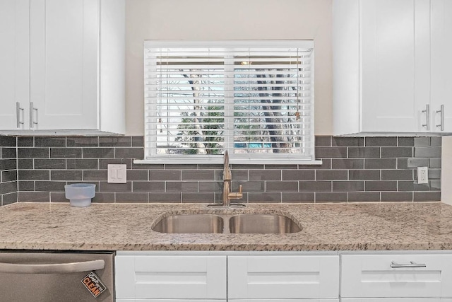 1808 Belford Dr, Austin, TX 78757 - kitchen featuring dishwasher, white cabinets, light stone counters, and tasteful backsplash