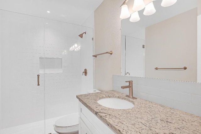 1808 Belford Dr, Austin, TX 78757 - bathroom featuring a stall shower, vanity, and decorative backsplash