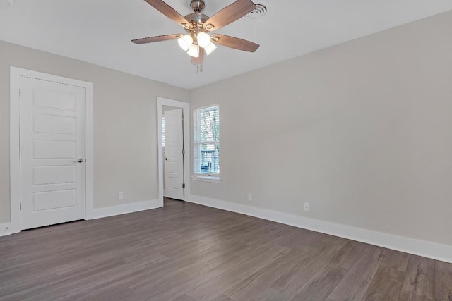 1808 Belford Dr, Austin, TX 78757 - unfurnished room featuring dark wood-style flooring and a ceiling fan
