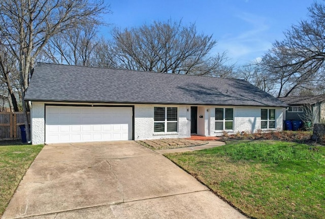 ranch-style home with a garage and a front lawn