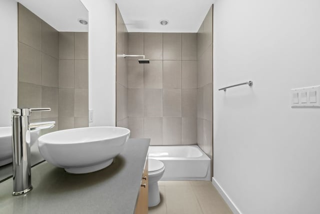 full bathroom with tile patterned floors, vanity, toilet, and tiled shower / bath