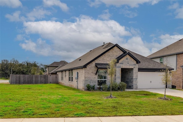 view of front of property featuring a garage and a front yard