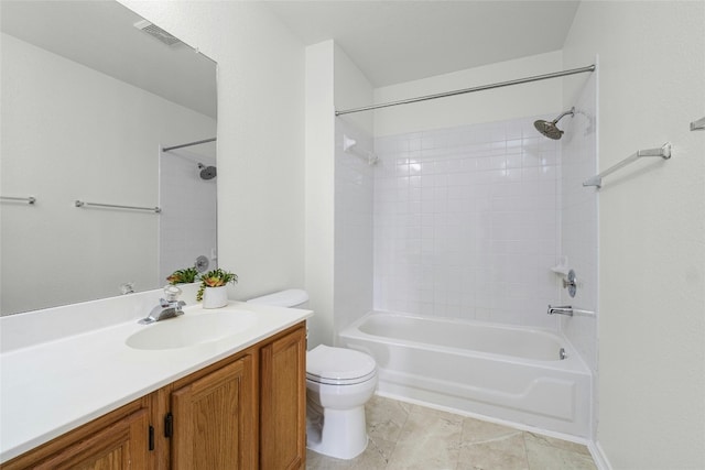 full bathroom with vanity, tiled shower / bath, and toilet