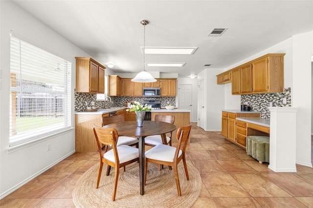 tiled dining room with sink