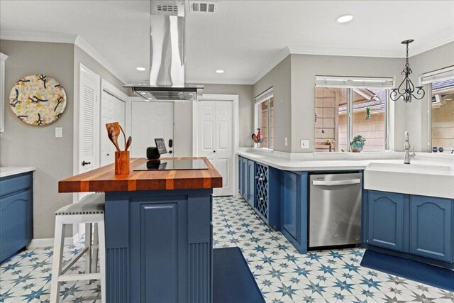 10920 Crown Colony Dr Unit C, Austin, TX 78747 - kitchen with blue cabinets, light floors, stainless steel dishwasher, butcher block countertops, and exhaust hood