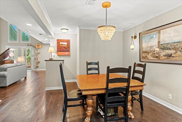10920 Crown Colony Dr Unit C, Austin, TX 78747 - dining area with baseboards, ornamental molding, dark wood-style flooring, and a chandelier
