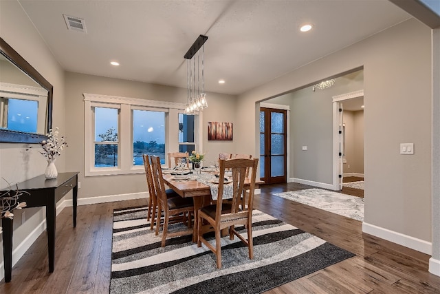 dining space featuring dark hardwood / wood-style floors