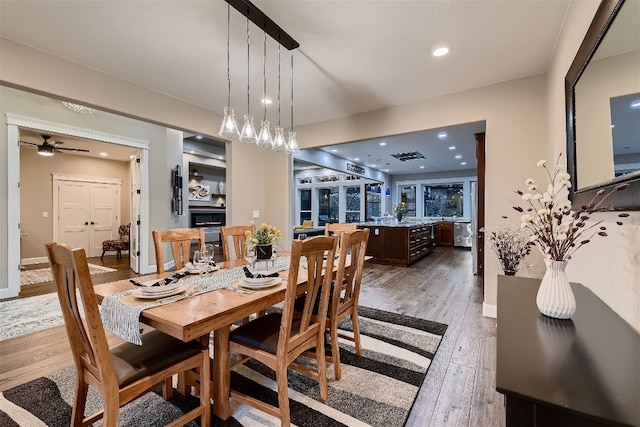 dining space featuring wood-type flooring