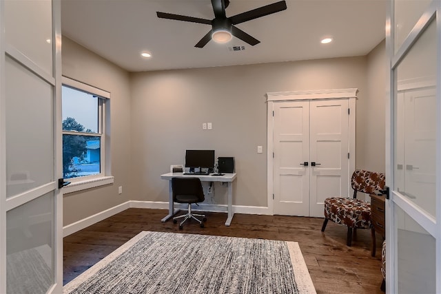 office with ceiling fan and dark wood-type flooring