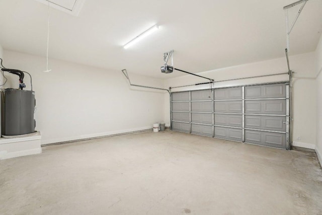 garage with water heater, a garage door opener, and baseboards