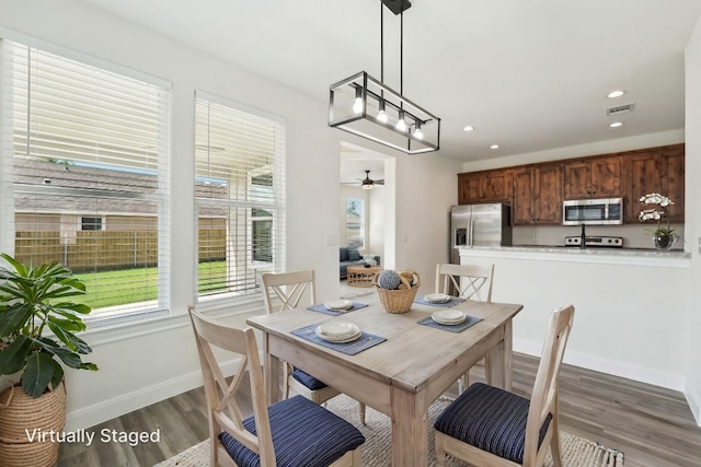dining area with a ceiling fan, wood finished floors, baseboards, visible vents, and recessed lighting