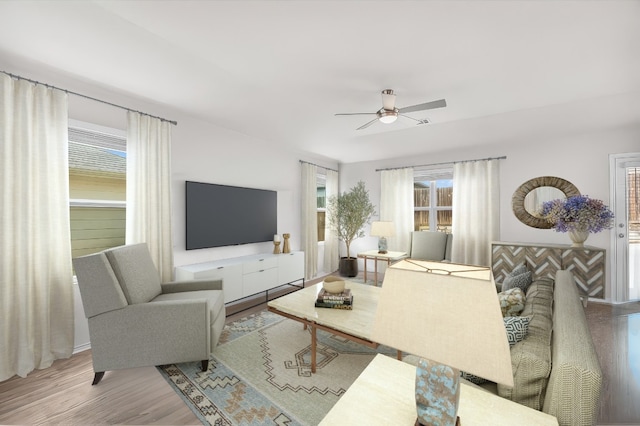 living room featuring ceiling fan and wood-type flooring