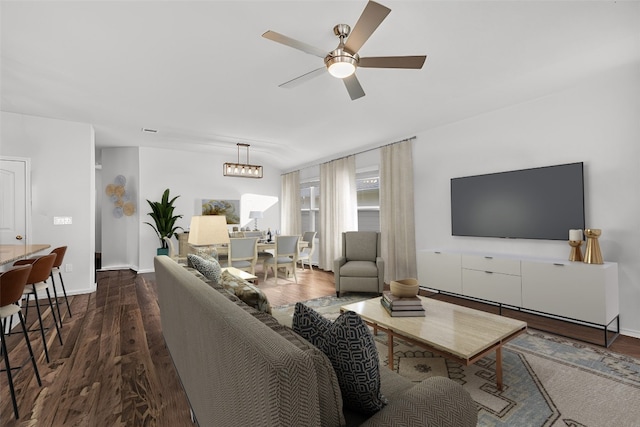 5812 Brampton Ln, Austin, TX 78724 - living room with a ceiling fan, baseboards, and dark wood-type flooring