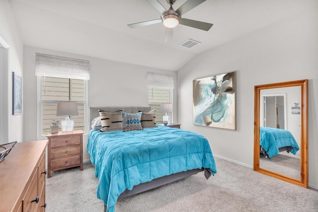 carpeted bedroom featuring vaulted ceiling and ceiling fan