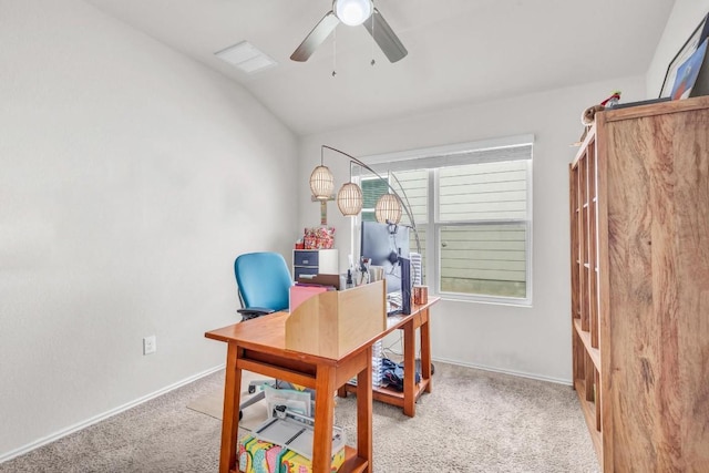 carpeted office space featuring lofted ceiling and ceiling fan