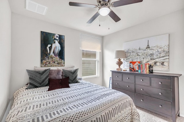 bedroom featuring light carpet and ceiling fan