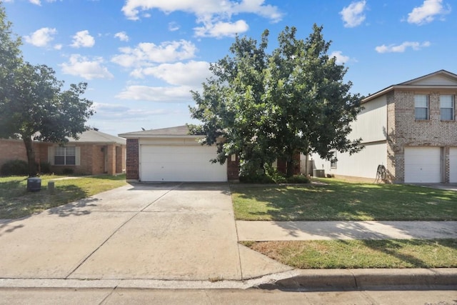 17405 Wiseman Dr, Pflugerville, TX 78660 - view of front of house featuring brick siding, a front yard, concrete driveway, and a garage