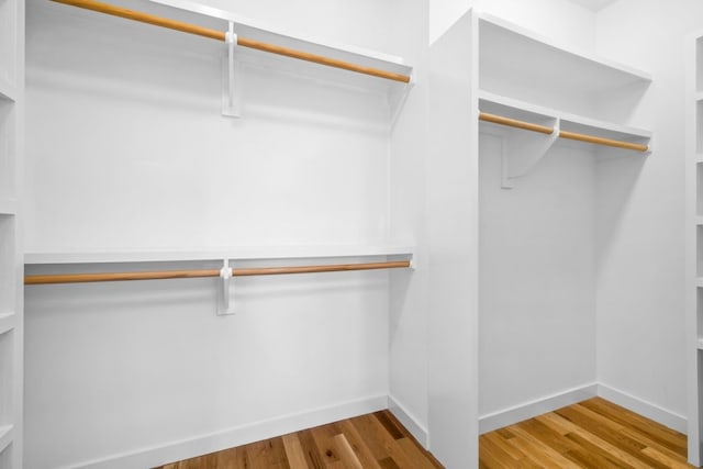 spacious closet with wood finished floors