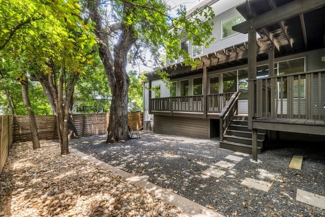 exterior space with a deck and a fenced backyard