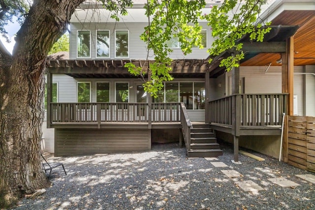 rear view of property with a deck