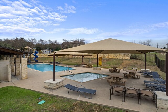 578 Ledge Stone Dr, Austin, TX 78737 - community pool with a gazebo, a water slide, and a patio