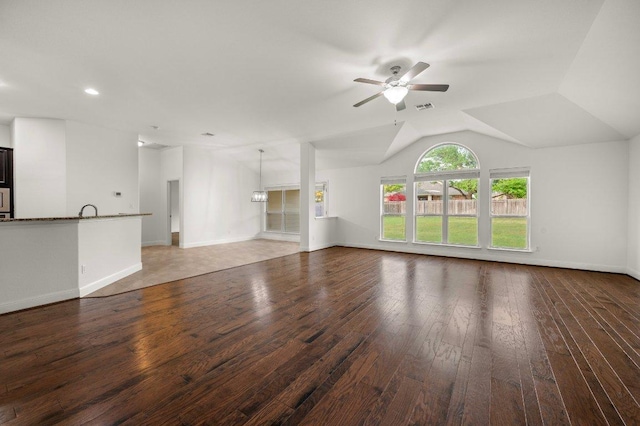 578 Ledge Stone Dr, Austin, TX 78737 - unfurnished living room featuring hardwood / wood-style flooring, a ceiling fan, vaulted ceiling, a sink, and baseboards