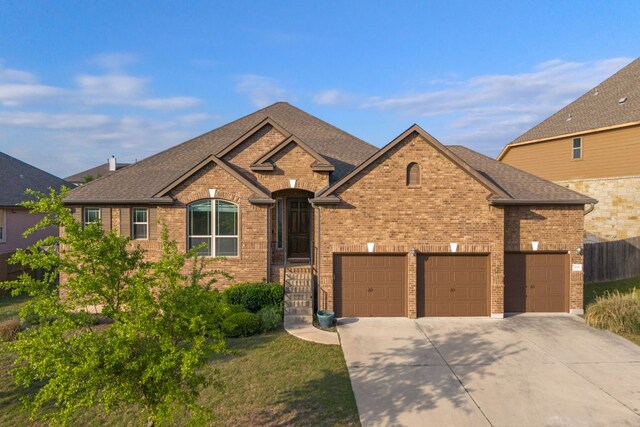 578 Ledge Stone Dr, Austin, TX 78737 - french provincial home with driveway, brick siding, and roof with shingles