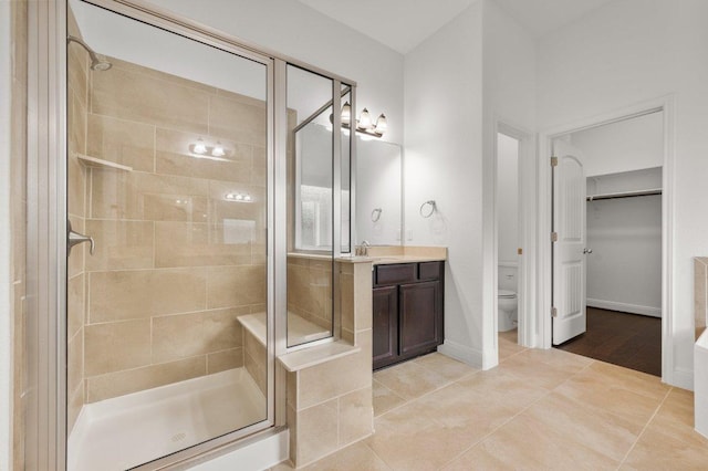 578 Ledge Stone Dr, Austin, TX 78737 - full bath with a shower stall, toilet, vanity, and tile patterned flooring