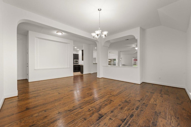 578 Ledge Stone Dr, Austin, TX 78737 - unfurnished living room with dark wood-style flooring, ceiling fan, baseboards, and a chandelier