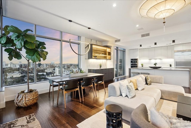 501 W Ave Unit 2904, Austin, TX 78701 - living area with hardwood / wood-style floors, recessed lighting, and a city view