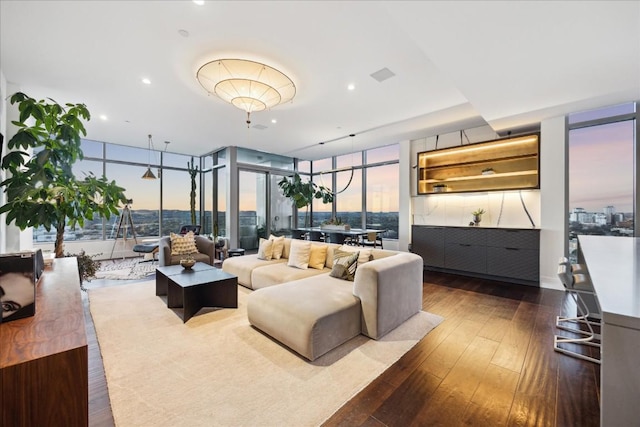 501 W Ave Unit 2904, Austin, TX 78701 - living area with dark wood-style flooring, expansive windows, and recessed lighting
