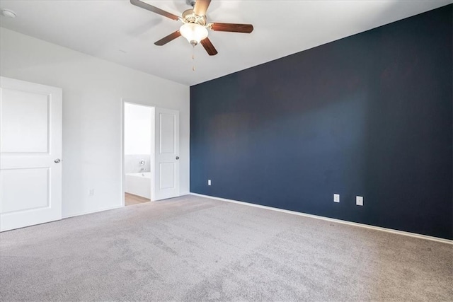 empty room with light colored carpet and ceiling fan