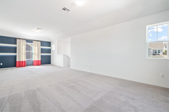 unfurnished room with light colored carpet