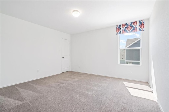 empty room featuring carpet flooring
