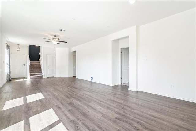 unfurnished living room with ceiling fan and hardwood / wood-style floors