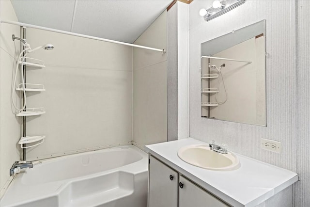 bathroom featuring shower / tub combination and vanity