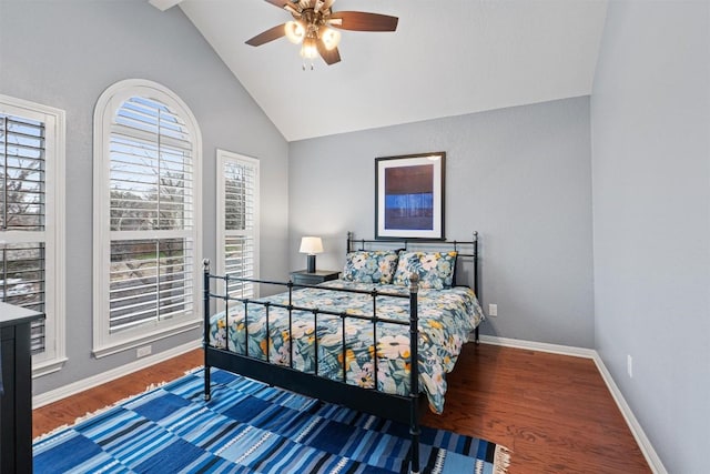 bedroom with high vaulted ceiling, hardwood / wood-style floors, and ceiling fan