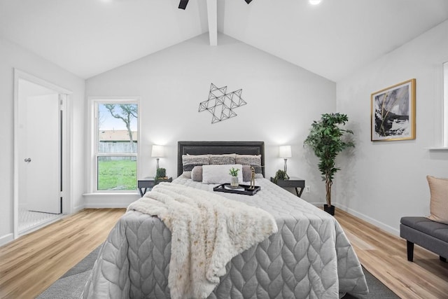 bedroom featuring lofted ceiling with beams and light hardwood / wood-style floors