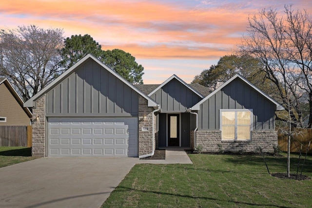 view of front of home with fence, a garage, a front yard, board and batten siding, and driveway