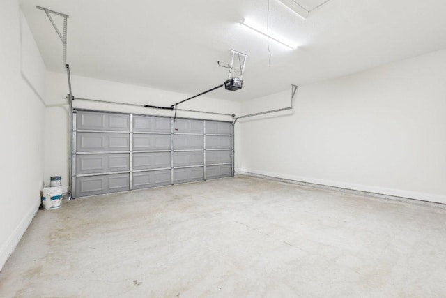 garage featuring baseboards and a garage door opener