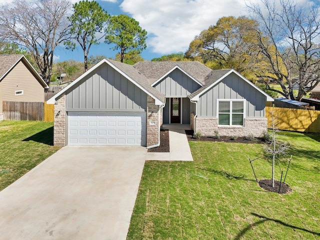 view of front of property featuring board and batten siding, concrete driveway, fence, and a front lawn