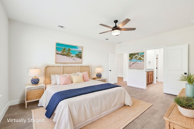 bedroom with baseboards, light wood-type flooring, visible vents, and ceiling fan