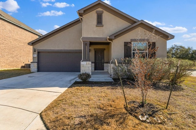 view of front of property with a garage and a front lawn