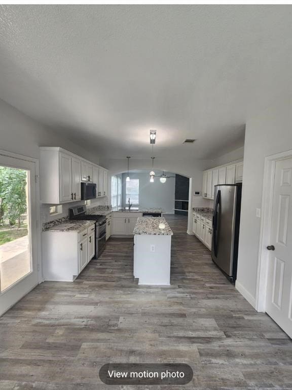 2500 National Park Blvd, Austin, TX 78747 - kitchen featuring appliances with stainless steel finishes, healthy amount of natural light, and white cabinetry