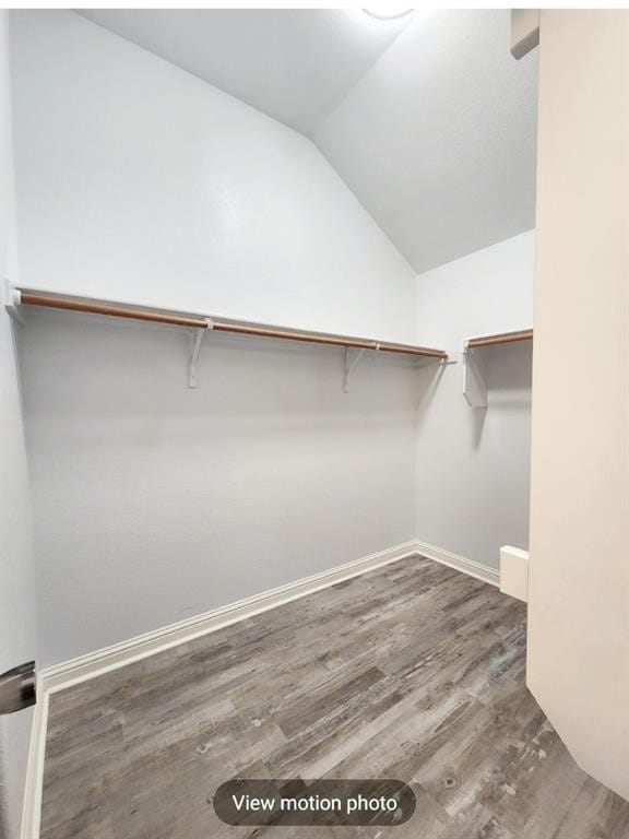 2500 National Park Blvd, Austin, TX 78747 - spacious closet featuring vaulted ceiling and wood finished floors