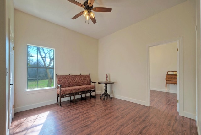 sitting room with ceiling fan and dark hardwood / wood-style floors