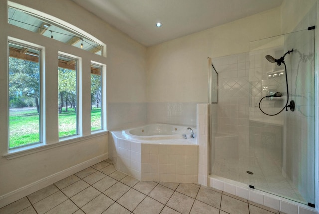 bathroom featuring separate shower and tub and tile patterned floors