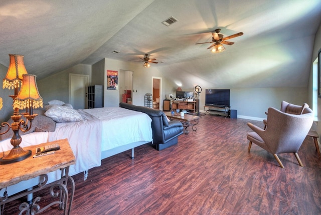 bedroom featuring ceiling fan, dark hardwood / wood-style floors, a textured ceiling, and lofted ceiling