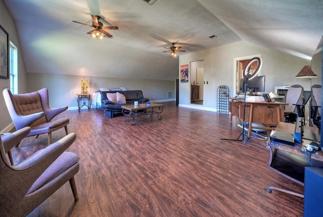 office with ceiling fan, vaulted ceiling, dark wood-type flooring, and a textured ceiling